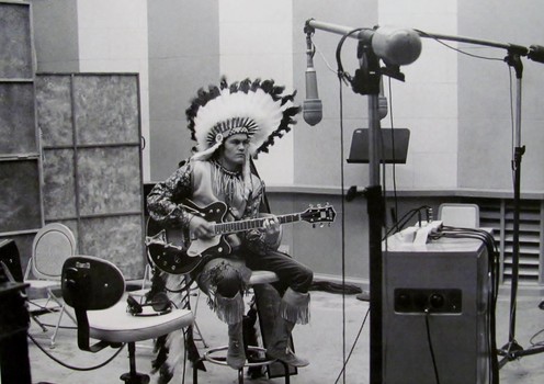 Sometime in summer 1967, a rare photo of Micky in full Native American regalia, including a complete feather head-dress; Micky also wore a similar outfit to the Monterey Pop Festival; notice the striking Chet Atkins Gretsch Country Gentleman guitar